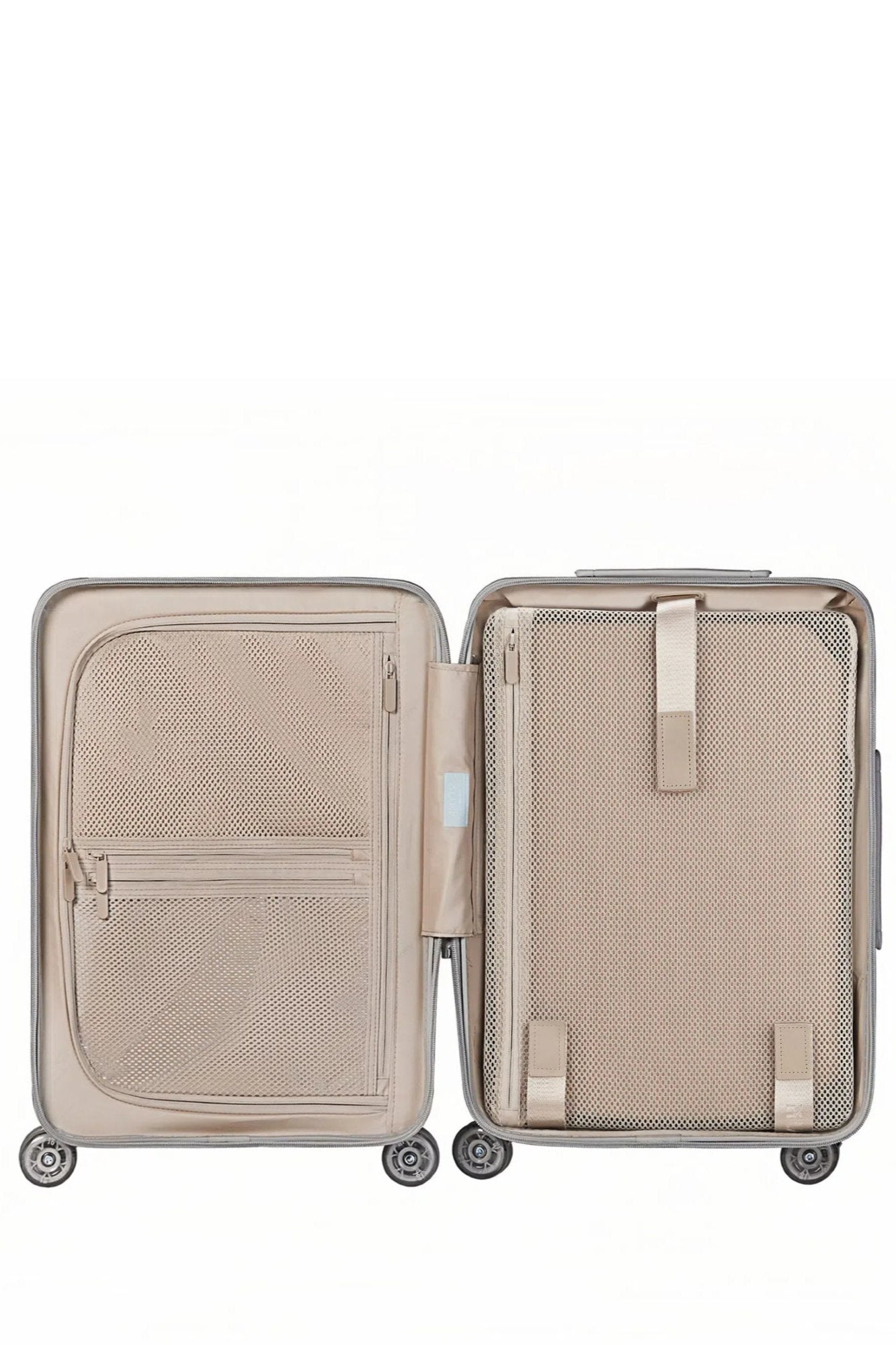 Interior of Delicate Blue suitcase with compartments and mesh pockets for organized travel.